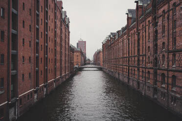 Hafencity canal between brick warehouse buildings, Hamburg, Germany - FSIF04248