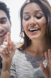 Smiling couple window shopping together - BLEF10166