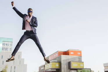 Young businessman jumping mid-air - LJF00467