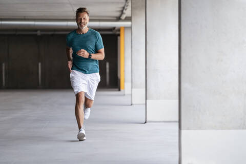 Sporty man jogging stock photo