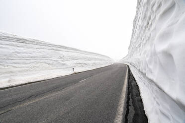 Empty mountain pass road in winter, Timmelsjoch, Tyrol, Austria - STSF02119