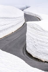 Empty mountain pass road in winter, Timmelsjoch, Tyrol, Austria - STSF02120