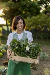 Woman working in her vegetable garden - MAUF02683
