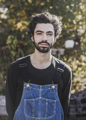 Portrait of bearded man in garden - VGPF00060