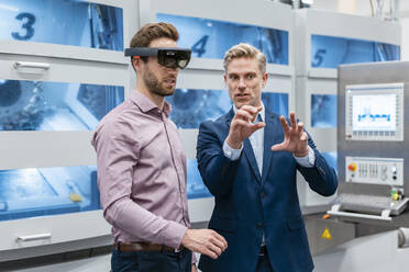 Two businessmen with AR glasses in a modern factory - DIGF07627