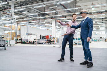 Two businessmen with AR glasses in a modern factory - DIGF07691