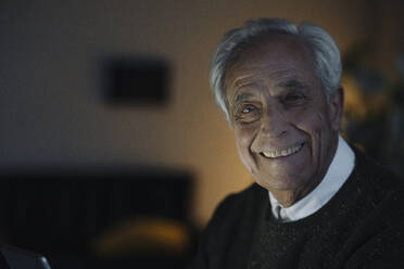 Portrait of smiling senior man at home - GUSF02212