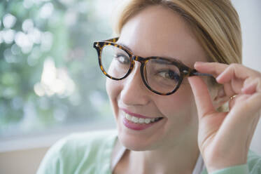 Smiling Caucasian woman wearing eyeglasses - BLEF10357