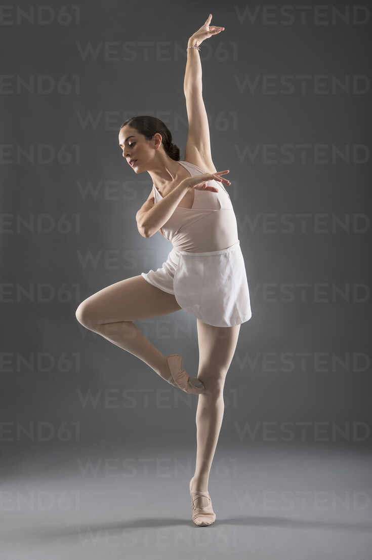 Beautiful ballet girl standing in ballet pose Stock Photo by stockfilmstudio