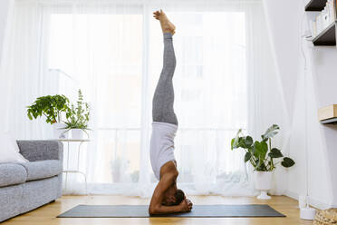 Side View of Slim Muslim Woman Bending Forward on Yoga Mat Trying To Reach  Tiptoes with Hands, People Stock Footage ft. bending & hands - Envato  Elements