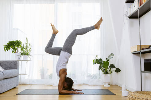 Woman practicing yoga at home - SODF00025