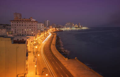 Long exposure of cars on waterfront at night, Havana, Cuba - BLEF10597