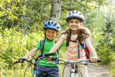 Caucasian children riding mountain bikes - BLEF10978