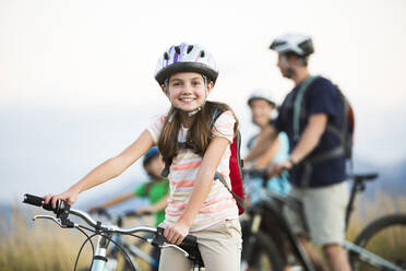 Caucasian girl smiling on mountain bike - BLEF10985