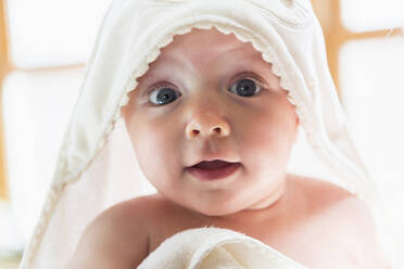 Caucasian baby wrapped in towel - BLEF11081