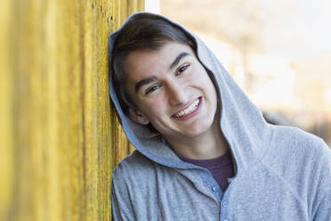 Mixed race teenage boy smiling - BLEF11082