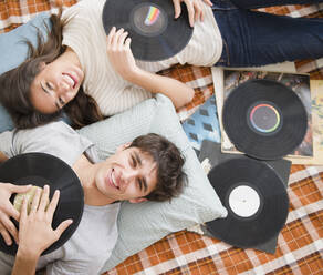 Couple listening to vinyl records together - BLEF11122