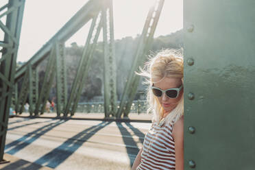 Caucasian woman standing on bridge - BLEF11286