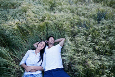 Couple laying in grass - BLEF11670