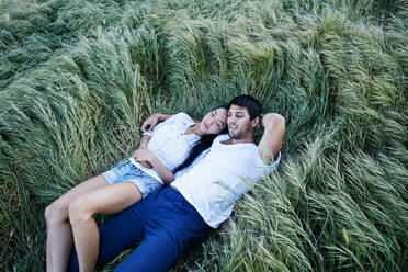 Couple laying in grass - BLEF11671