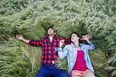 Couple laying in grass - BLEF11692