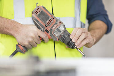 Worker holding drill - ZEF16168