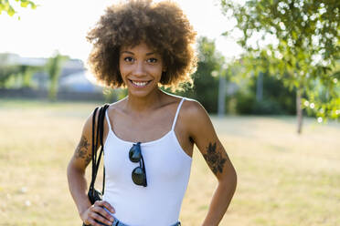 Portrait of tattooed young woman in summer - GIOF06901