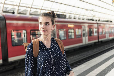 Portrait of young woman at the train station - UUF18298