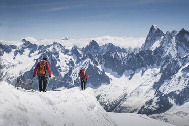 Caucasian skiers walking on mountaintop, Mont Blanc, Chamonix, France - BLEF11962