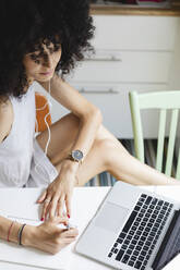 Young woman studying with her laptop - MRAF00403