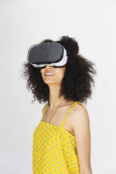 Young woman wearing virtual reality glasses - MRAF00414