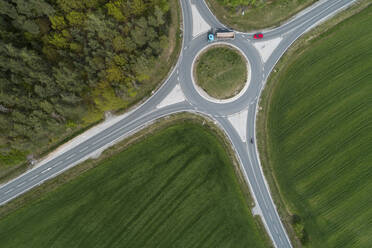 Aerial view of roundabout intersection with traffic. Franconia, Bavaria, Germany. - RUEF02269