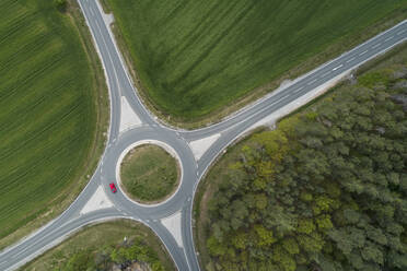 Aerial view of roundabout intersection with traffic. Franconia, Bavaria, Germany. - RUEF02270
