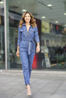 Mature woman wearing denim jumpsuit - PNEF01759