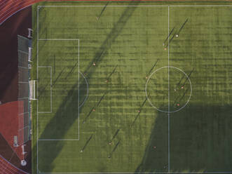 Aerial view of football player on soccer field, Tikhvin, Russia - KNTF02946