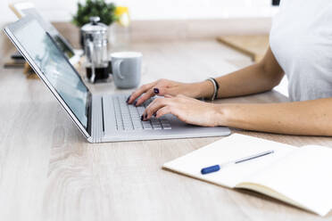 Close-up of young woman using laptop - GIOF06930