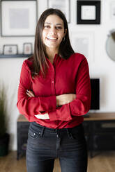 Portrait of happy young businesswoman at home - GIOF06978