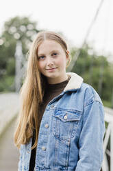 Portrait of teenage girl on a bridge - NMS00359