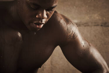 African American man sweating after exercise - BLEF12253