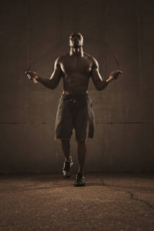 African American man jumping rope - BLEF12254