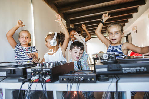 Young friends having a party at the turntable - LJF00546