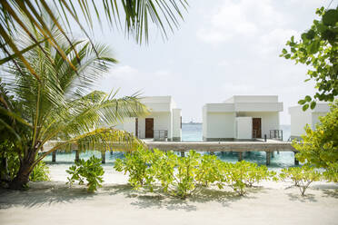 View of villas over sea against sky at Maldives - CVF01418