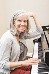 Caucasian woman playing piano - BLEF12566