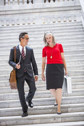 Business people talking on steps - BLEF12571