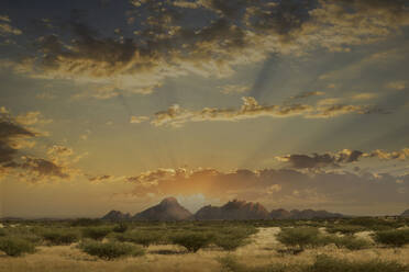 Dramatic sunrise over mountains in remote landscape - BLEF12705