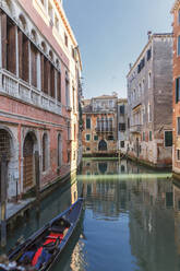 Gondola sailing in Venice canal, Veneto, Italy - BLEF12756