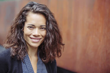 Mixed race businesswoman smiling - BLEF12790