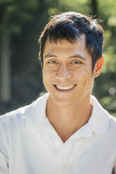 Close up of mixed race man smiling - BLEF12870