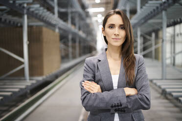 Portrait of confident businesswoman in a factory - BSZF01199