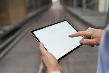 Close-up of businessman using tablet in factory - BSZF01206